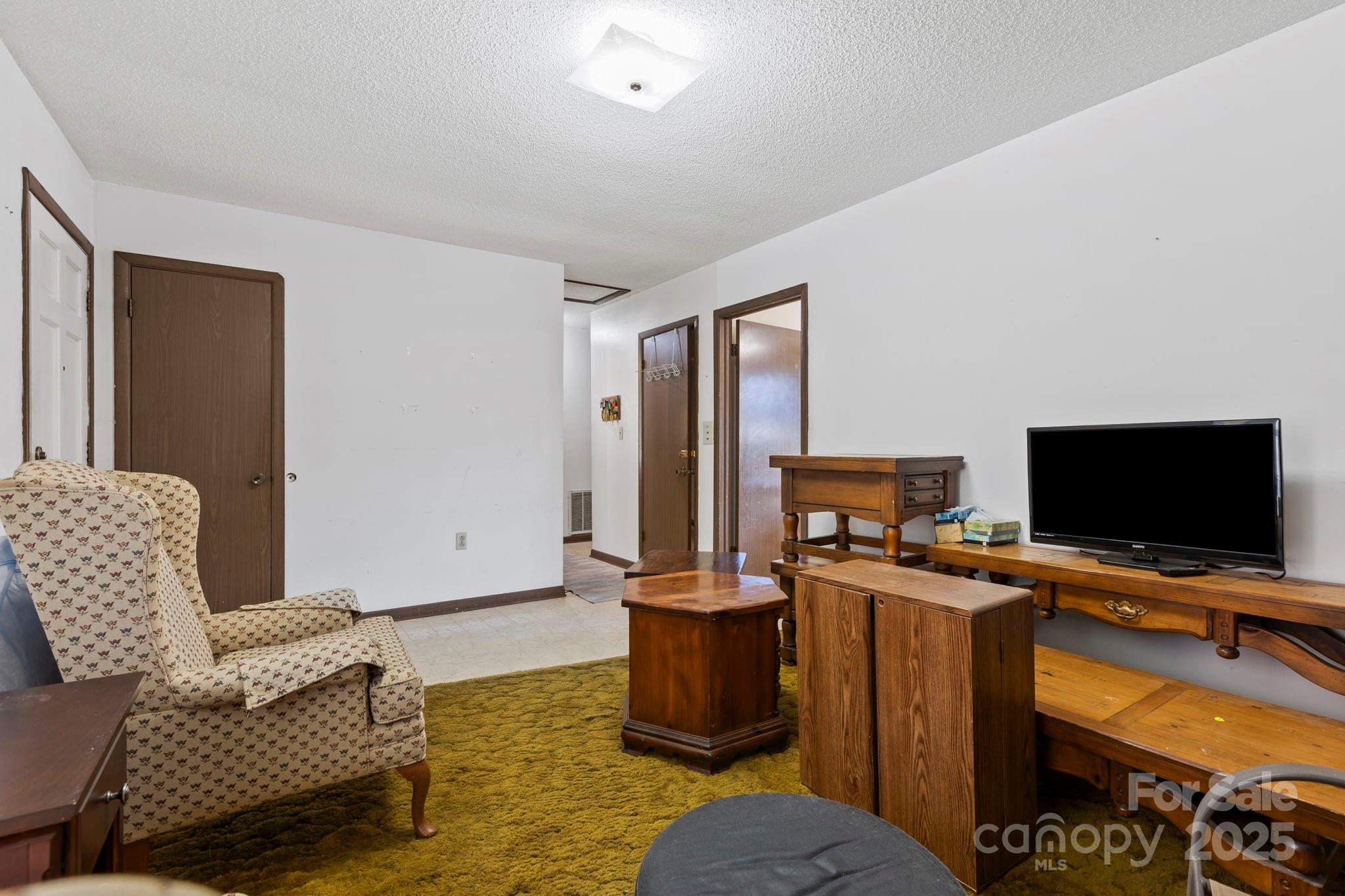 150 Trent Road Brevard, NC 28712 - Photo 7 of 22 a workspace with furniture and couch