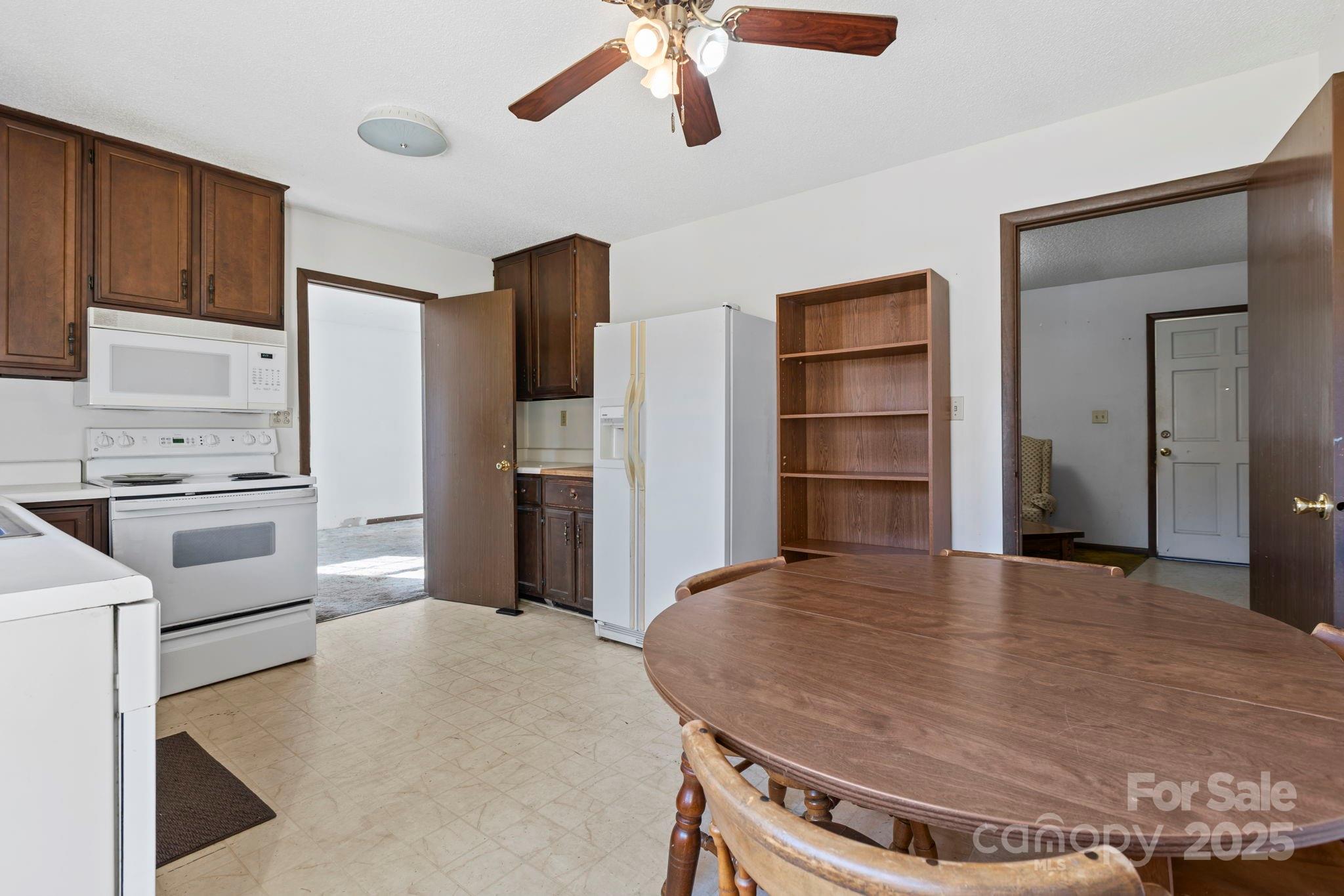 150 Trent Road Brevard, NC 28712 - Photo 8 of 22 a kitchen with a appliances and cabinets