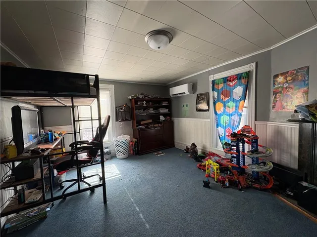 a bedroom with a large bed and a closet