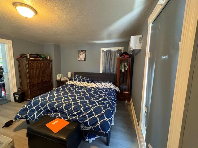 a bedroom with a bed and a walk in closet