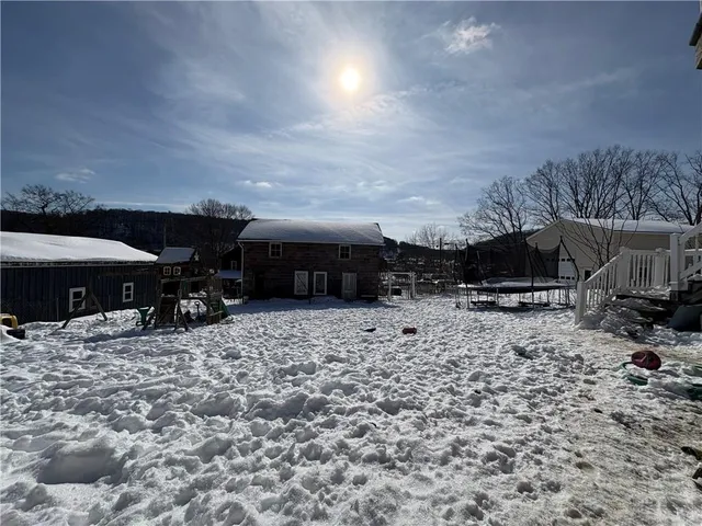 a view of a house with snow on the ground