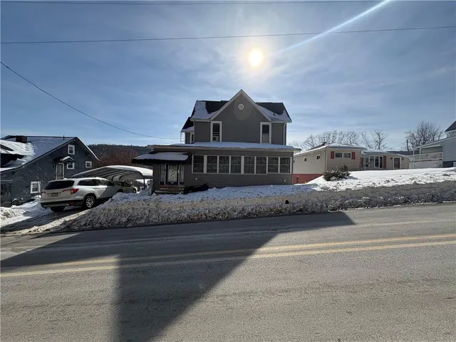 a view of a house with a street