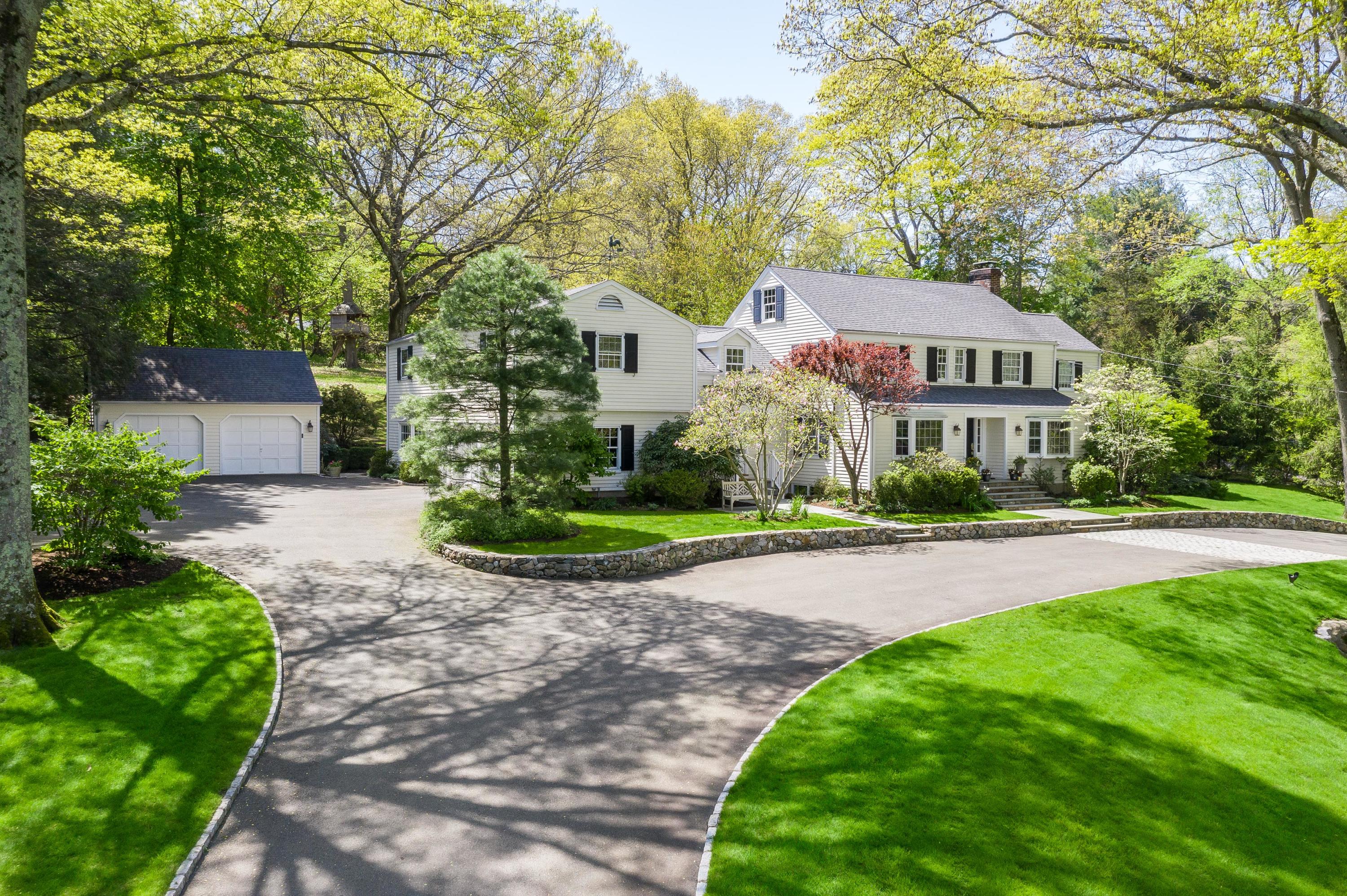 55 Maywood Road Darien, CT 06820 - Photo 1 of 23 a front view of a house with a yard and trees
