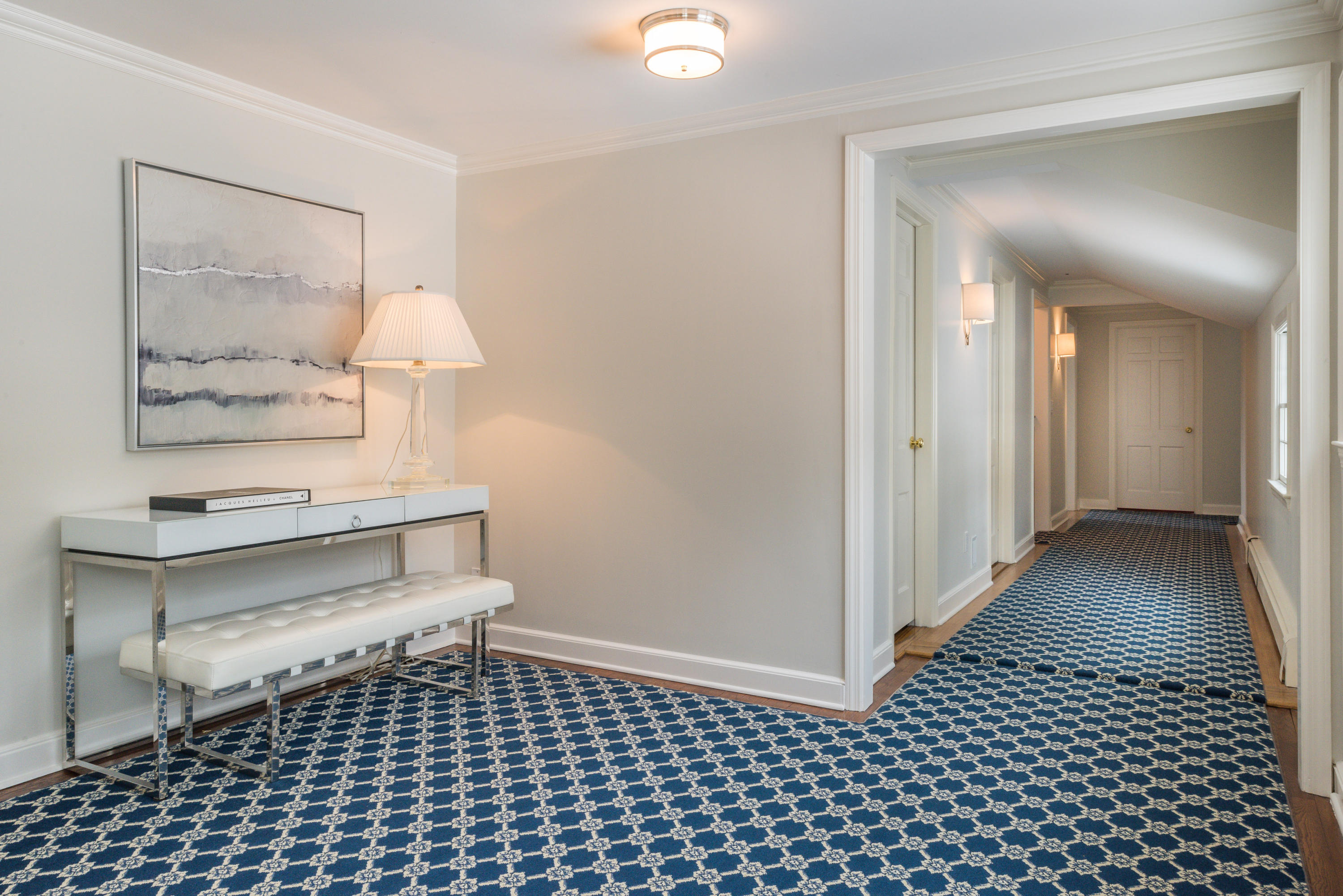 55 Maywood Road Darien, CT 06820 - Photo 15 of 23 a view of a hallway with wooden floor and furniture
