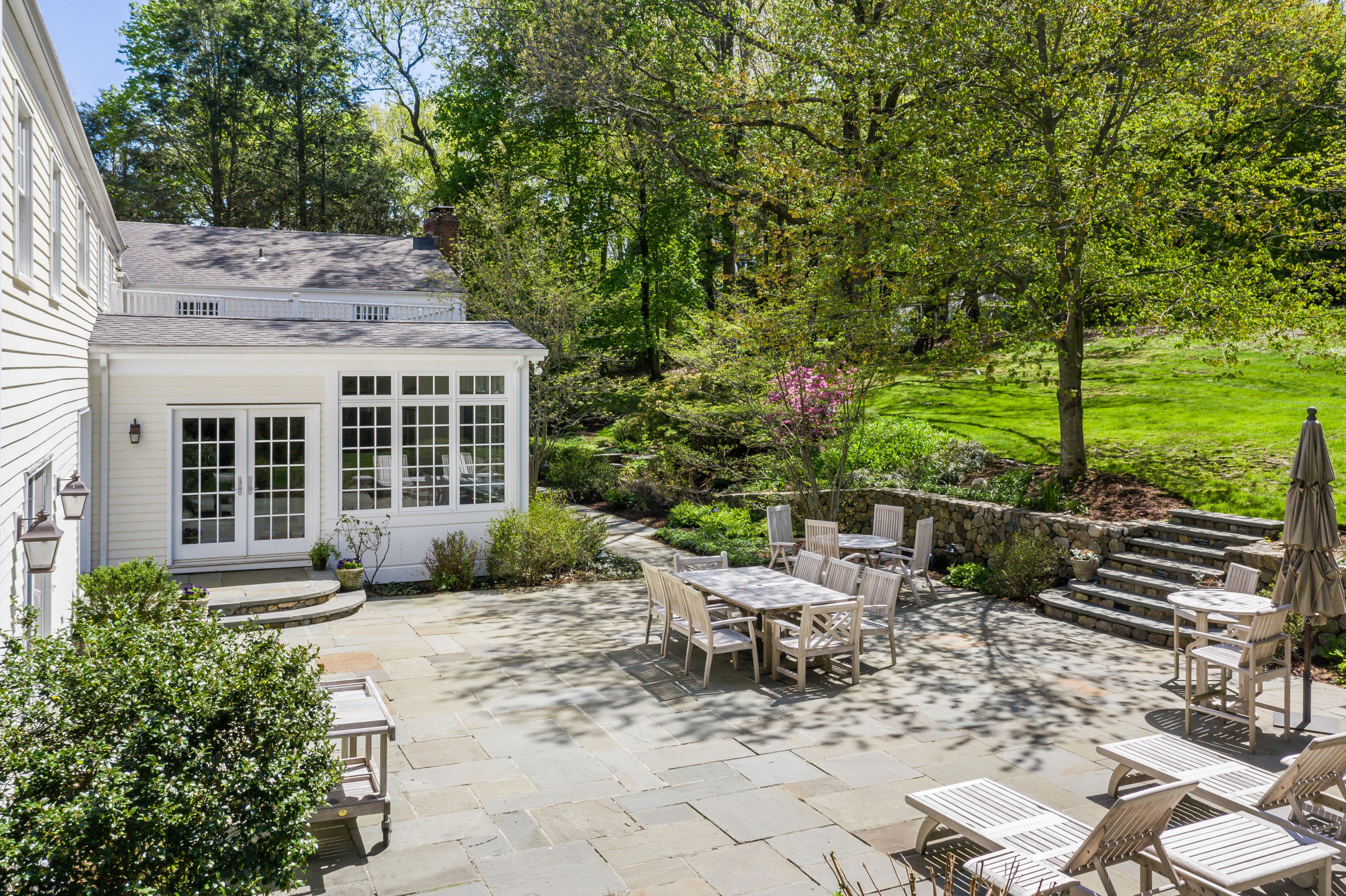 55 Maywood Road Darien, CT 06820 - Photo 21 of 23 a view of a chairs and table in backyard of the house