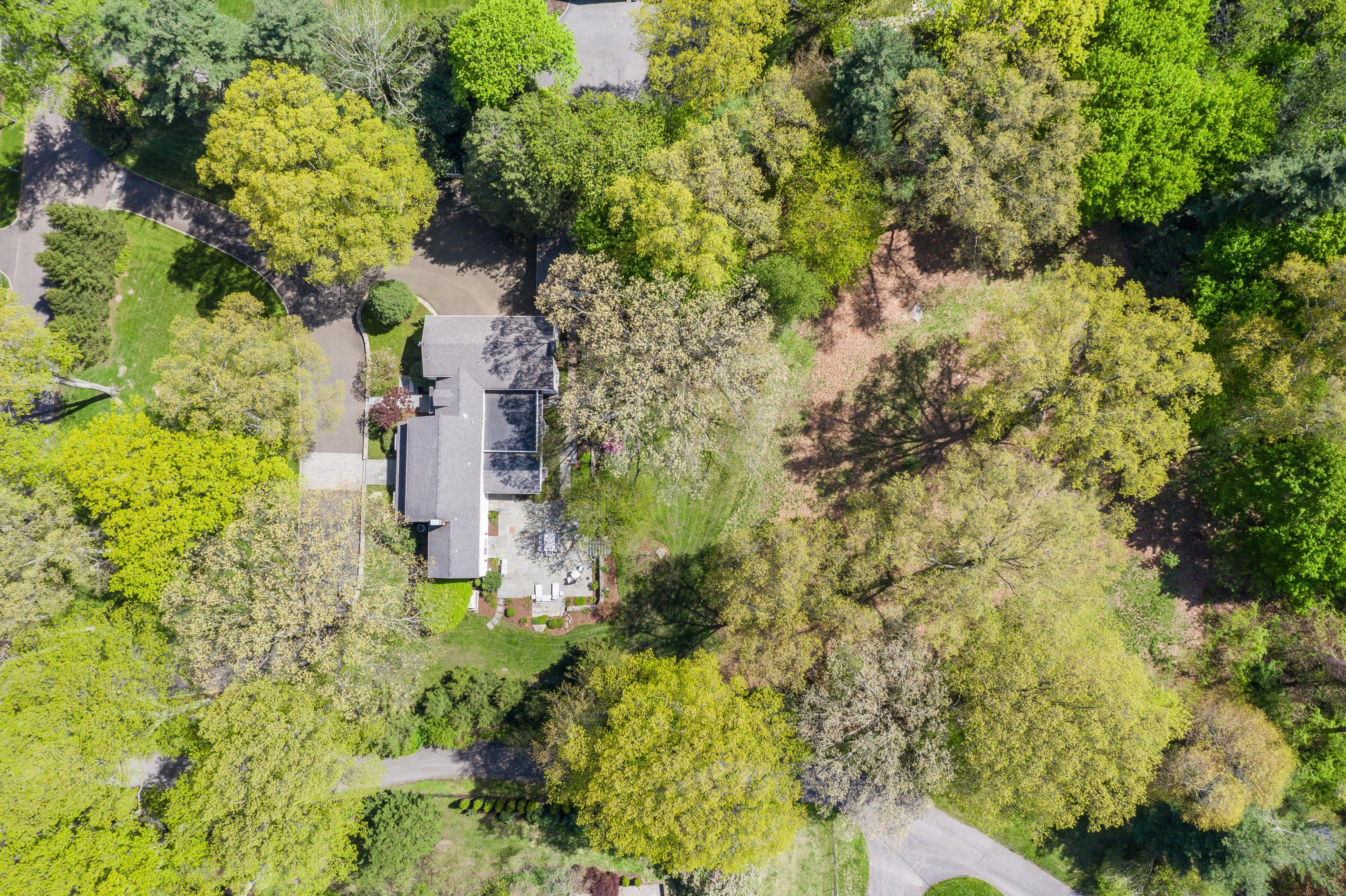 55 Maywood Road Darien, CT 06820 - Photo 23 of 23 a building view with large trees