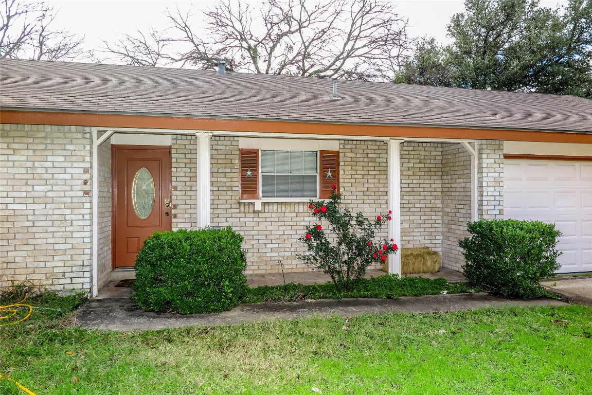 308 Golden Oaks Drive Georgetown, TX 78628 - Photo 1 of 25 a front view of a house with a yard and garage