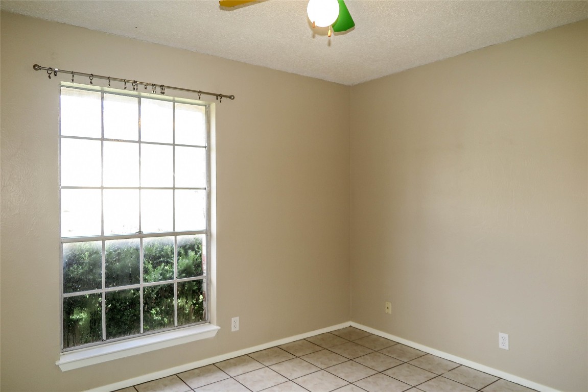 308 Golden Oaks Drive Georgetown, TX 78628 - Photo 11 of 25 an empty room with a window