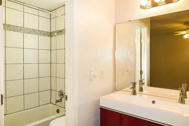 a bathroom with a sink and a shower