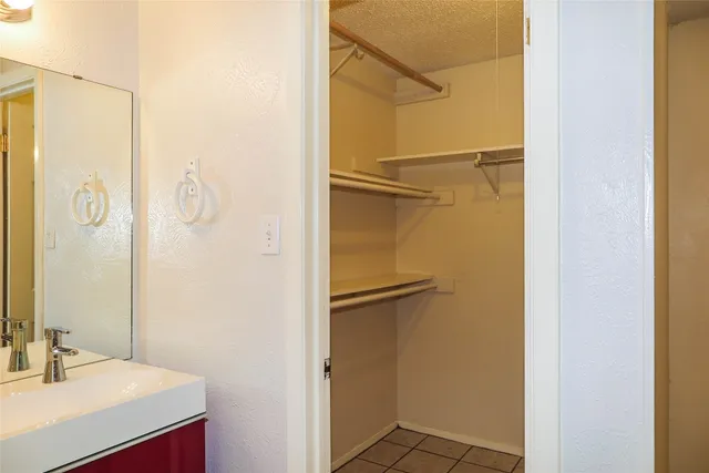 a bathroom with a shower and a sink