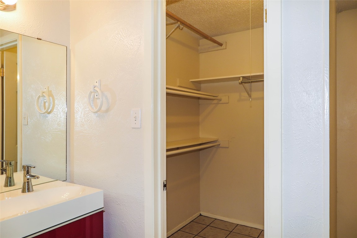 308 Golden Oaks Drive Georgetown, TX 78628 - Photo 21 of 25 a bathroom with a shower and a sink