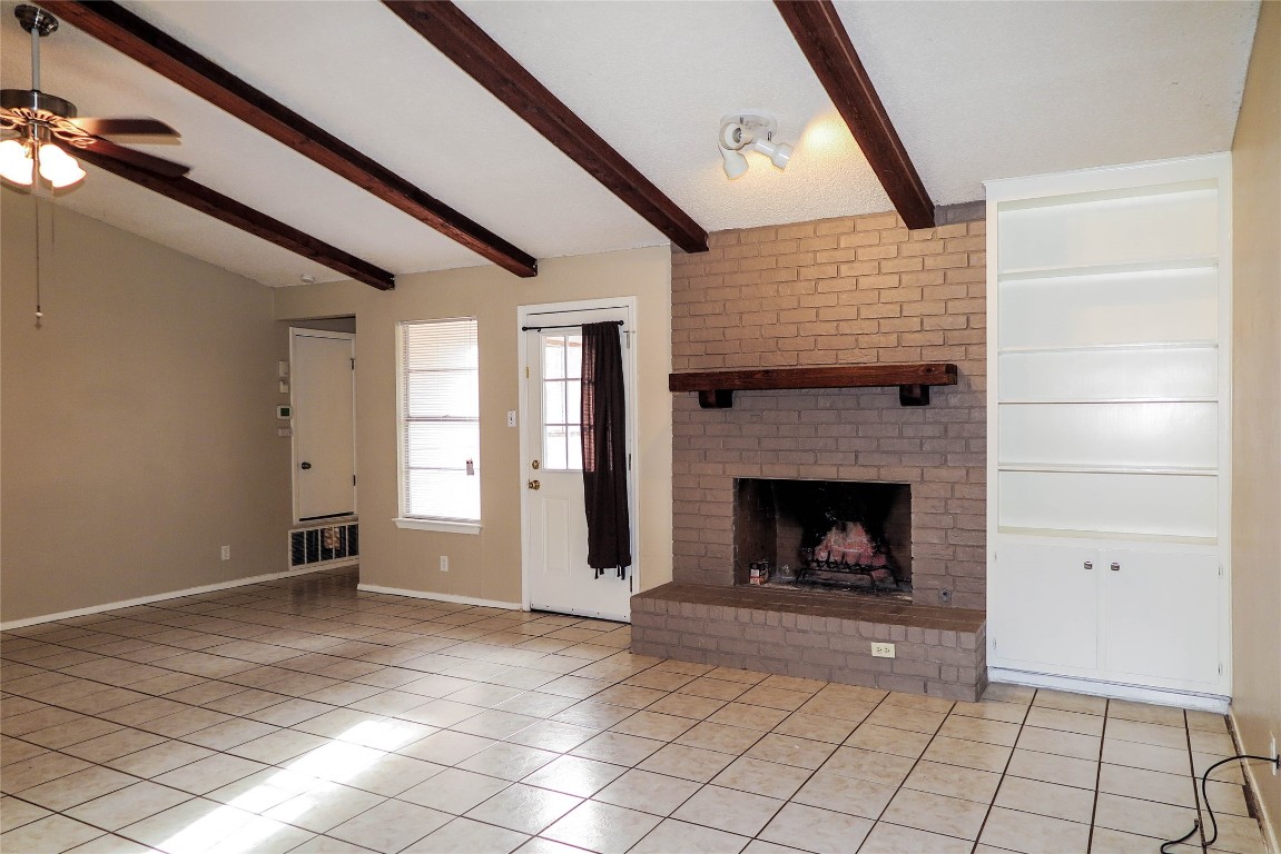 308 Golden Oaks Drive Georgetown, TX 78628 - Photo 8 of 25 a view of an empty room with window and fire place