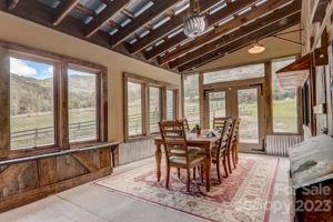 72 Scotchmans Road Waynesville, NC 28786 - Photo 14 of 46 a view of a dining room with furniture window and outside view