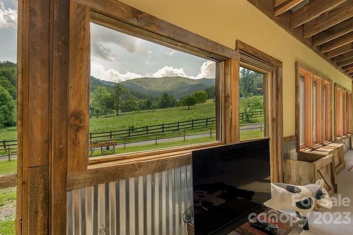 72 Scotchmans Road Waynesville, NC 28786 - Photo 15 of 46 a view of a room with a bed and wooden floor