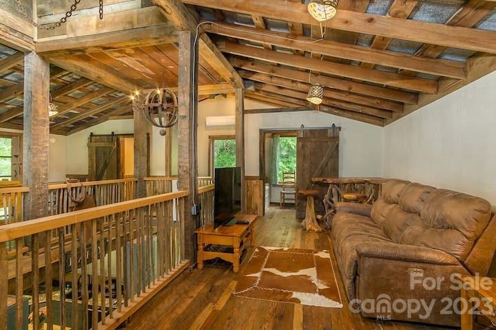 72 Scotchmans Road Waynesville, NC 28786 - Photo 23 of 46 a view of a living room with balcony