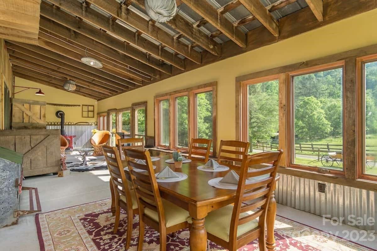 72 Scotchmans Road Waynesville, NC 28786 - Photo 26 of 46 a view of a dining room with furniture water view and balcony