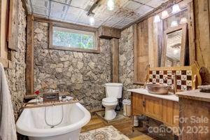 72 Scotchmans Road Waynesville, NC 28786 - Photo 31 of 46 a bathroom with a sink and a toilet