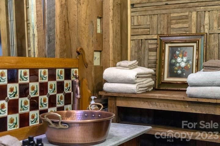 72 Scotchmans Road Waynesville, NC 28786 - Photo 32 of 46 a living room with furniture and a potted plant