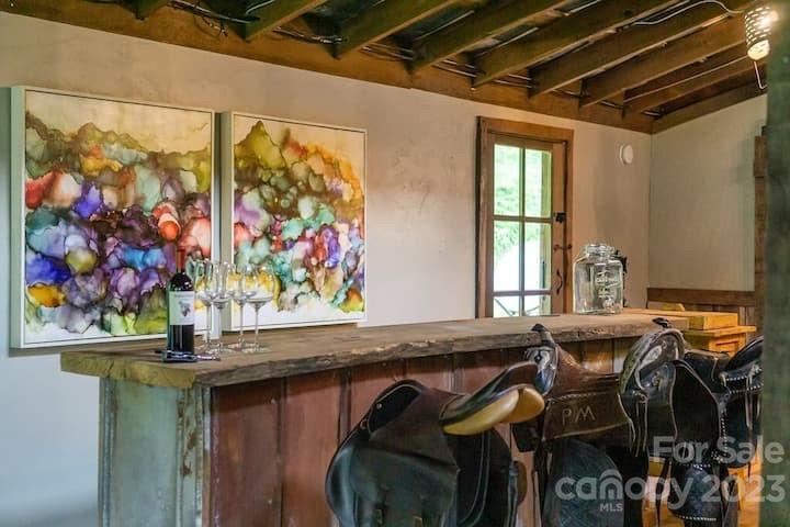72 Scotchmans Road Waynesville, NC 28786 - Photo 37 of 46 a view of a dining area with furniture and wall paintings
