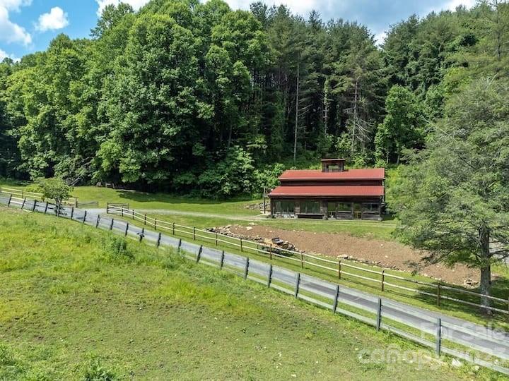 72 Scotchmans Road Waynesville, NC 28786 - Photo 42 of 46 a view of a bench in a garden