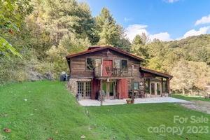 72 Scotchmans Road Waynesville, NC 28786 - Photo 46 of 46 a view of a house with a yard porch and sitting area