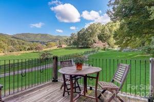 72 Scotchmans Road Waynesville, NC 28786 - Photo 5 of 46 a view of a chairs and table in patio