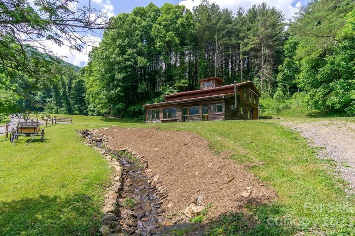 72 Scotchmans Road Waynesville, NC 28786 - Photo 7 of 46 a view of house with backyard space and sitting area