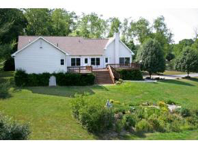 4314 Cold Springs Road Raphine, VA 24472 - Photo 2 of 8 a front view of a house with garden