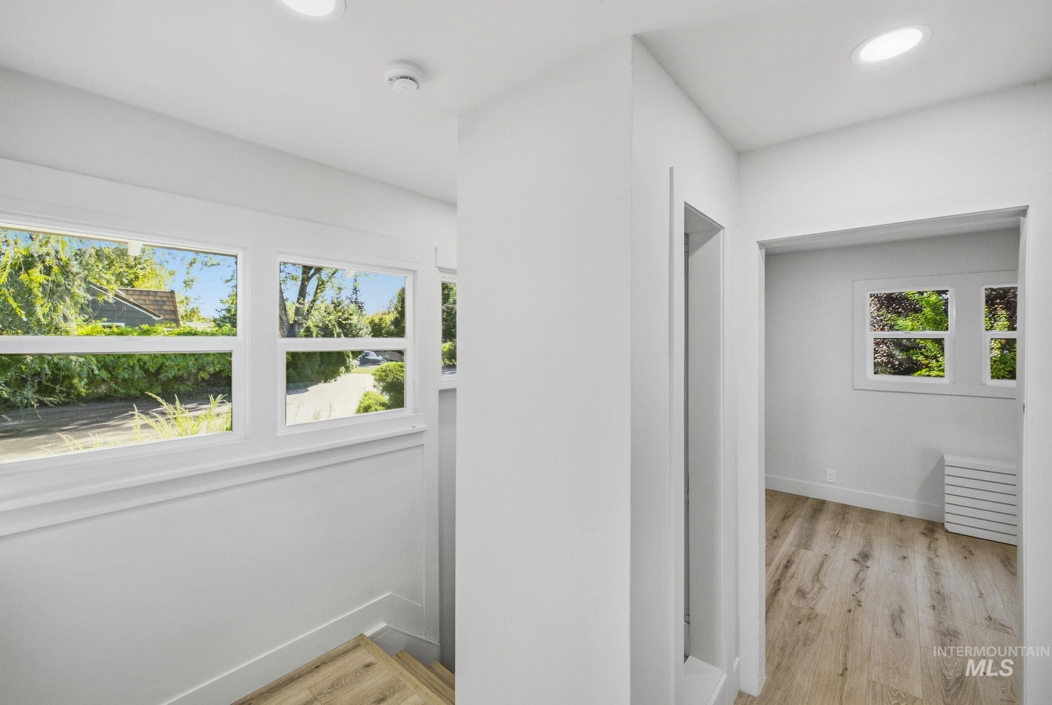 3113 West Overland Road Boise, ID 83705 - Photo 30 of 40 Recessed lighting illuminates the wood-finish flooring throughout