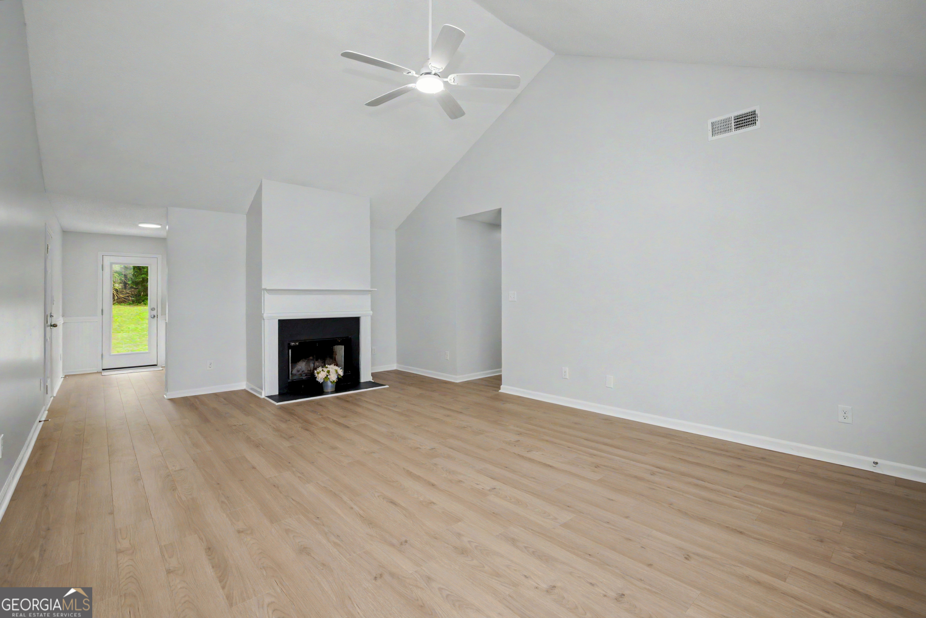 613 Coan Drive Locust Grove, GA 30248 - Photo 11 of 34 a view of an empty room with a fireplace