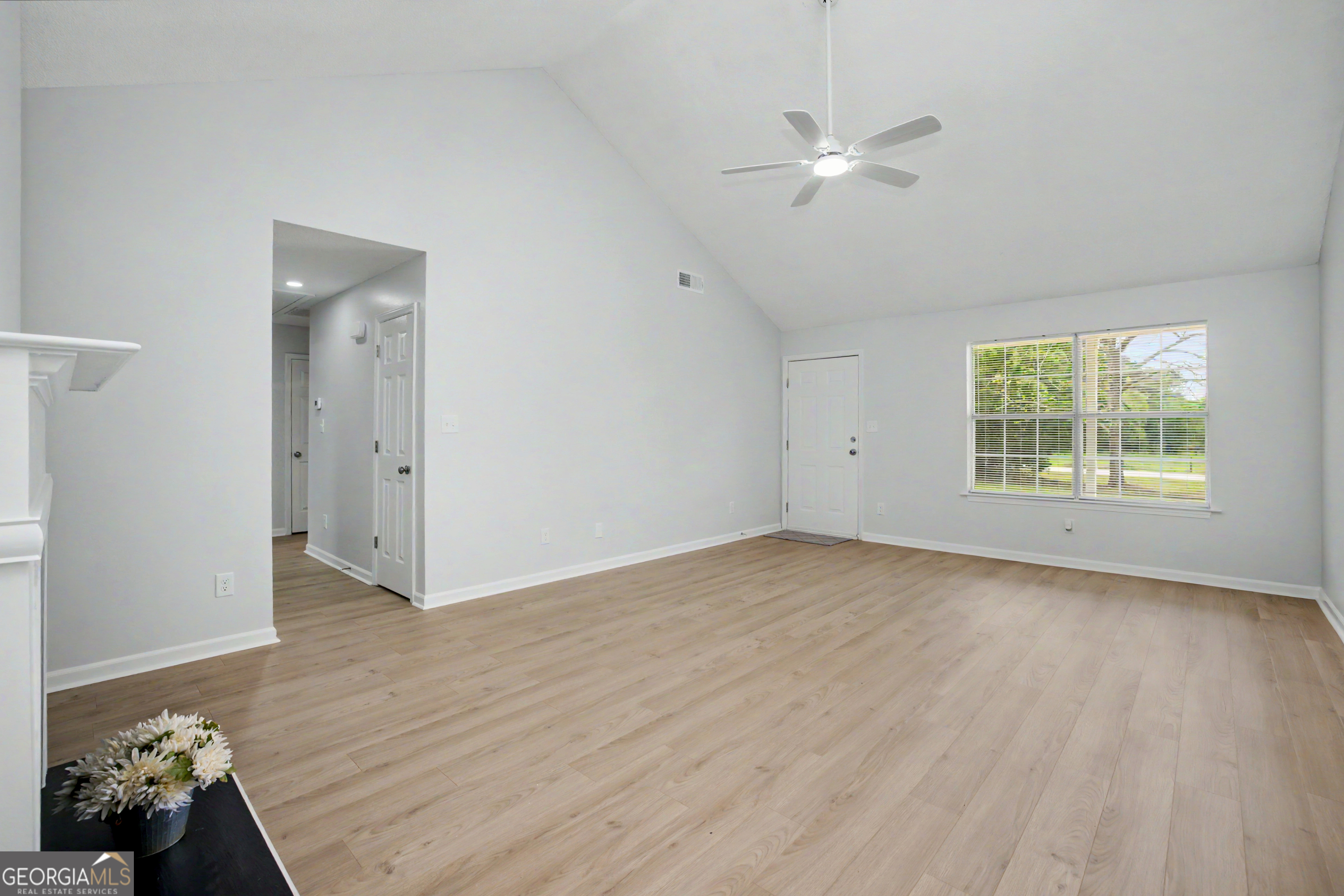 613 Coan Drive Locust Grove, GA 30248 - Photo 12 of 34 wooden floor in an empty room with a window