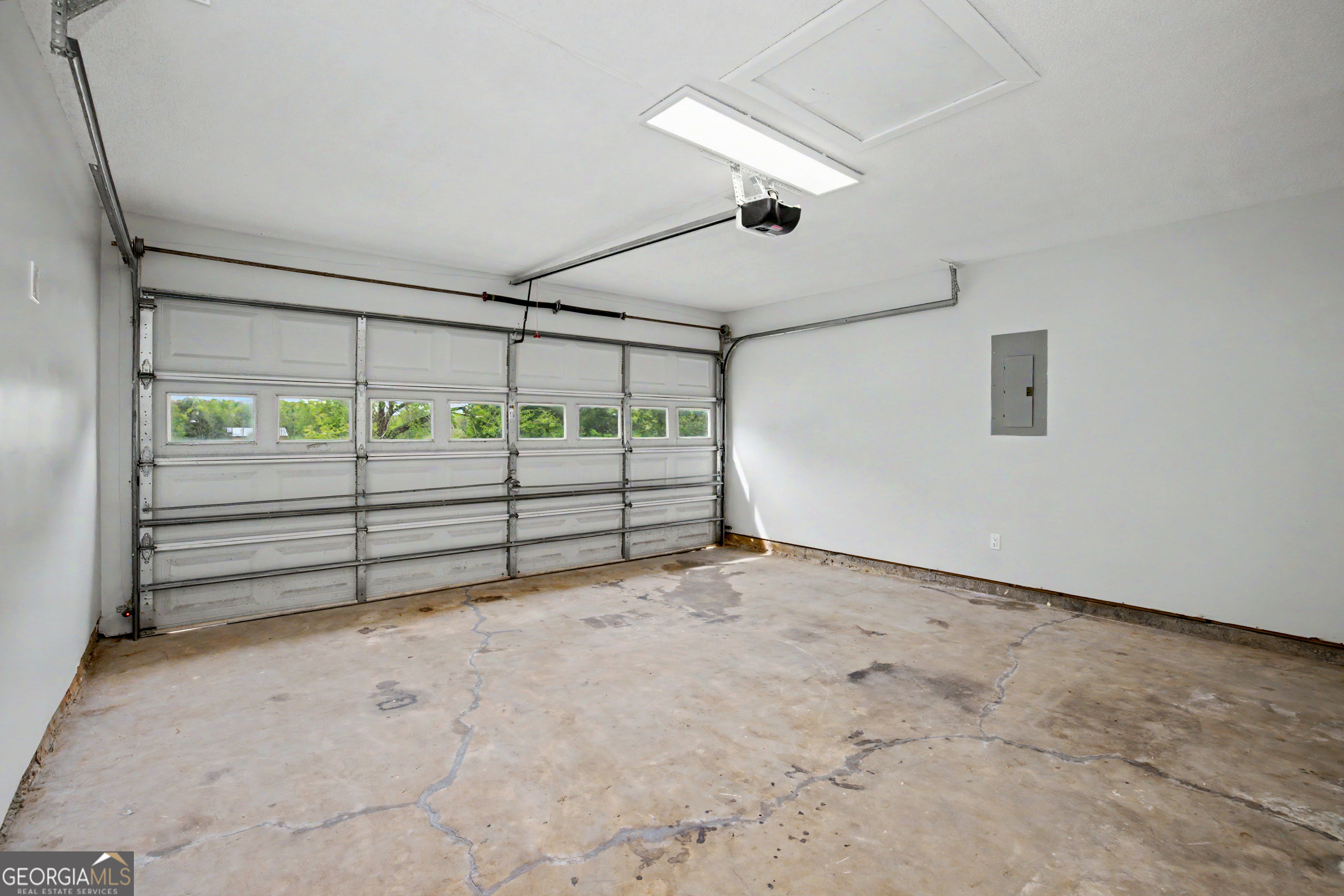 613 Coan Drive Locust Grove, GA 30248 - Photo 17 of 34 an empty room with windows and entrance
