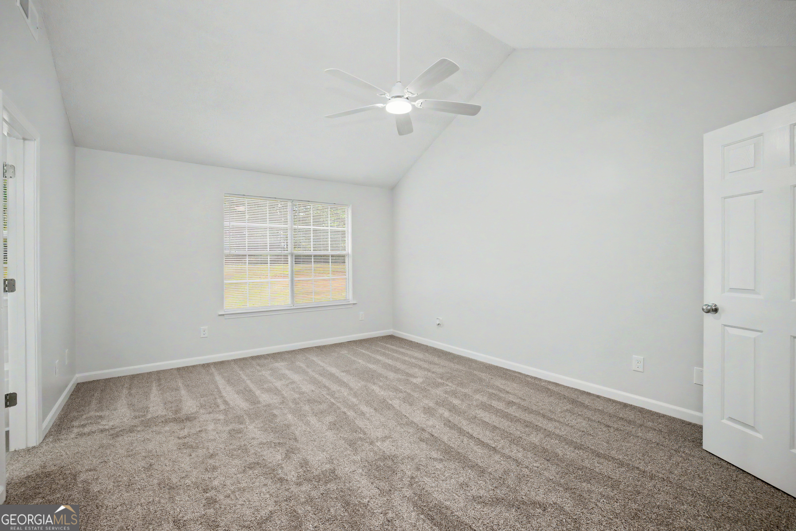 613 Coan Drive Locust Grove, GA 30248 - Photo 19 of 34 a view of an empty room with a window