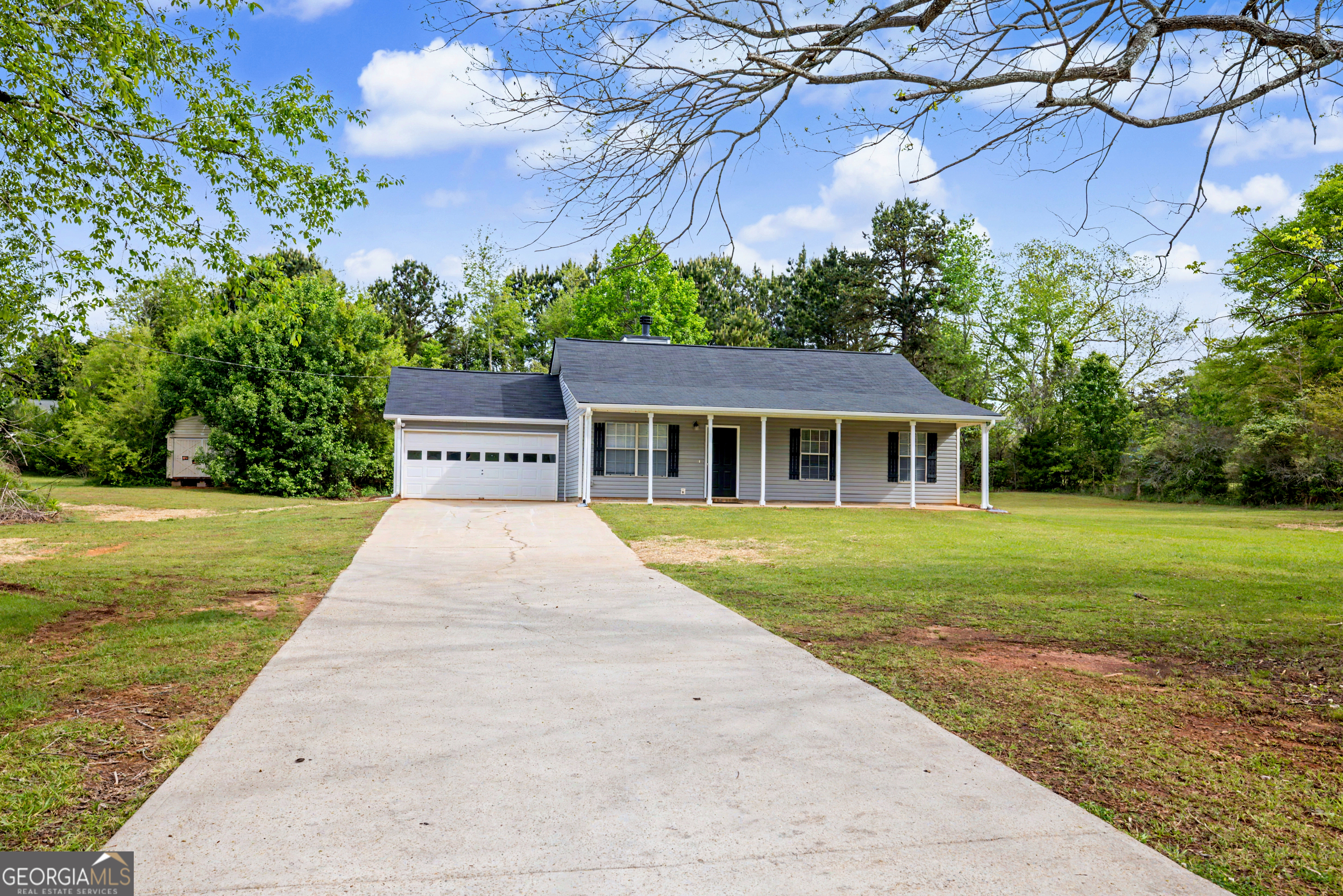 613 Coan Drive Locust Grove, GA 30248 - Photo 2 of 34 a view of house with garden