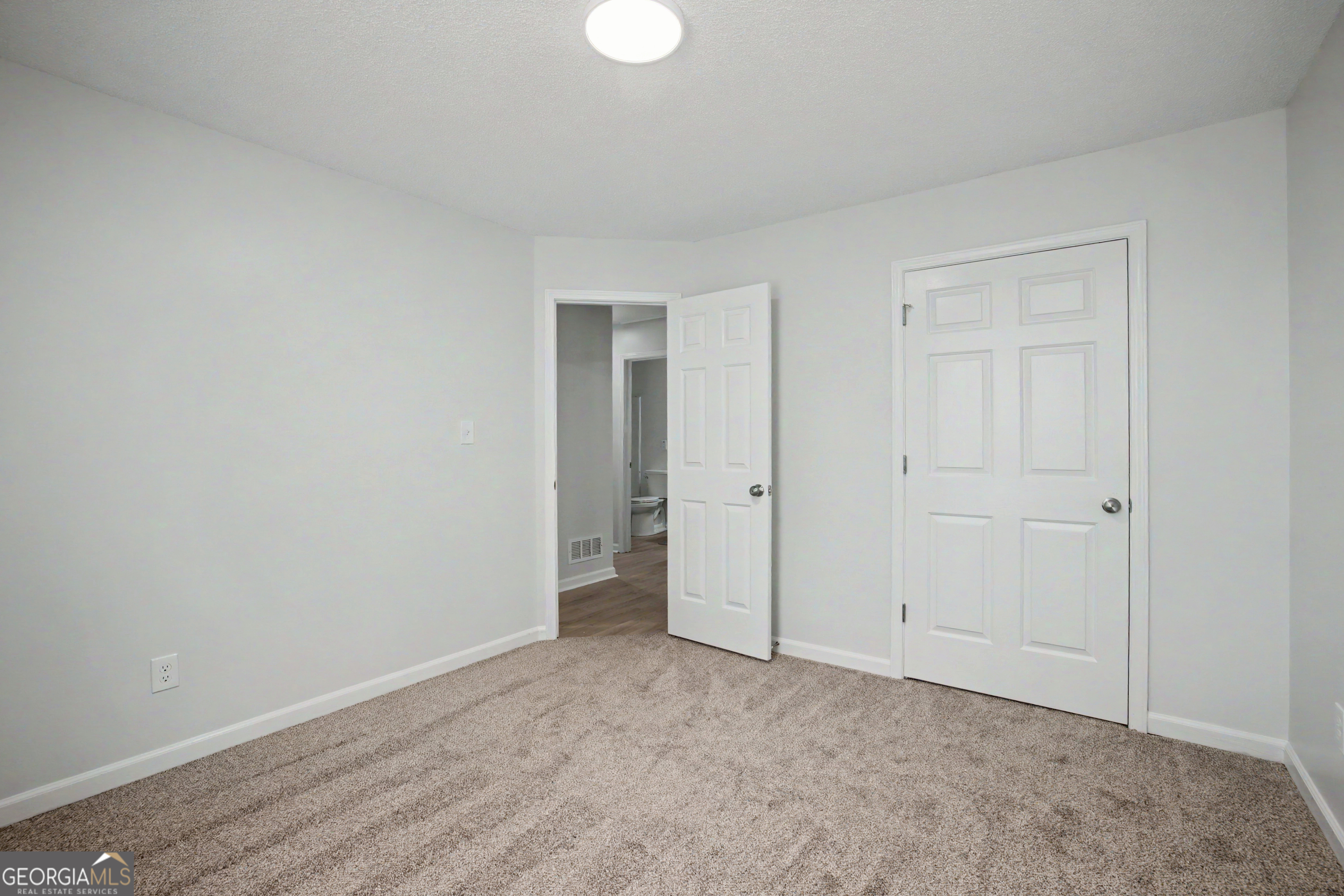613 Coan Drive Locust Grove, GA 30248 - Photo 24 of 34 a view of an empty room and closet area