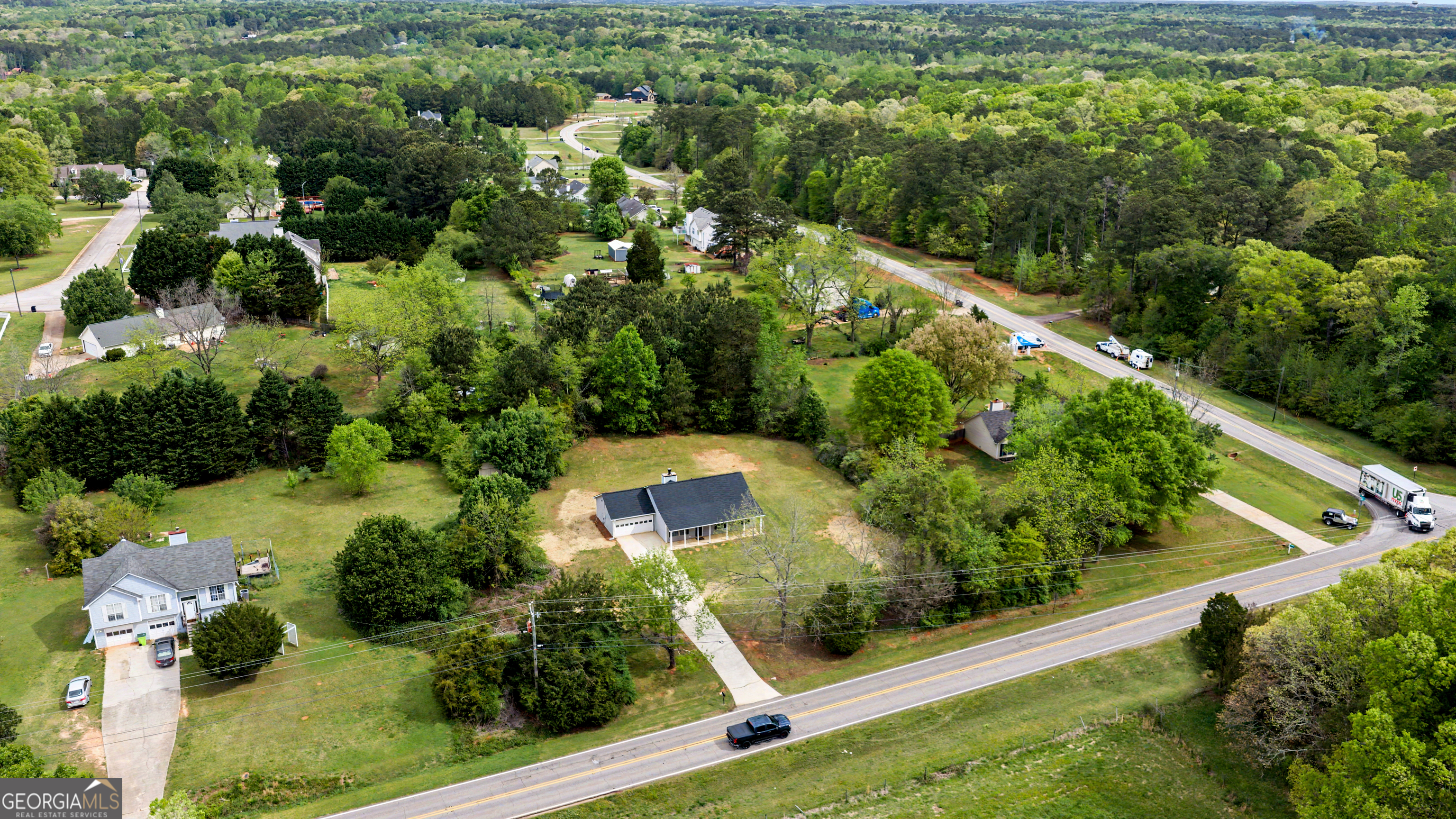 613 Coan Drive Locust Grove, GA 30248 - Photo 28 of 34 an aerial view of residential house with outdoor space and street view