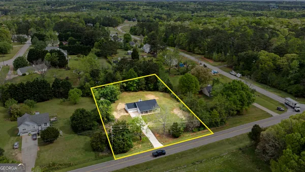 an aerial view of residential house with outdoor space