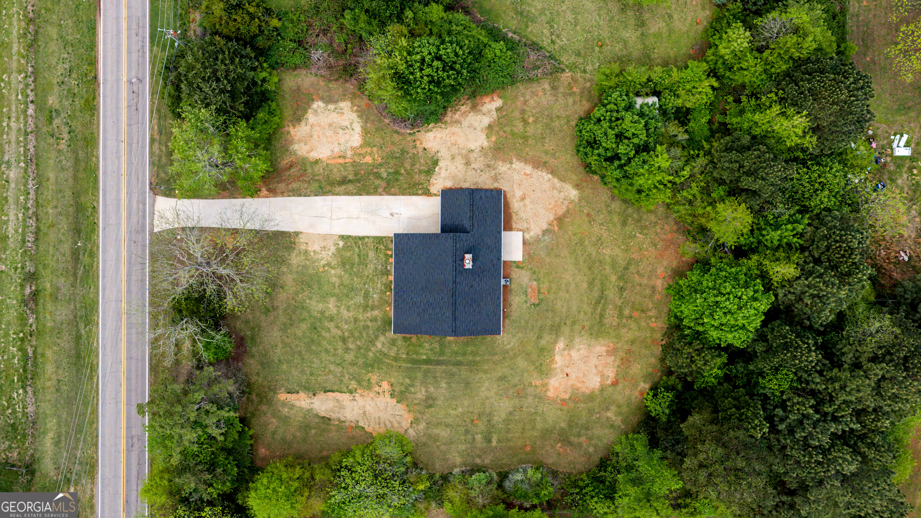 613 Coan Drive Locust Grove, GA 30248 - Photo 32 of 34 an aerial view of residential house with outdoor space