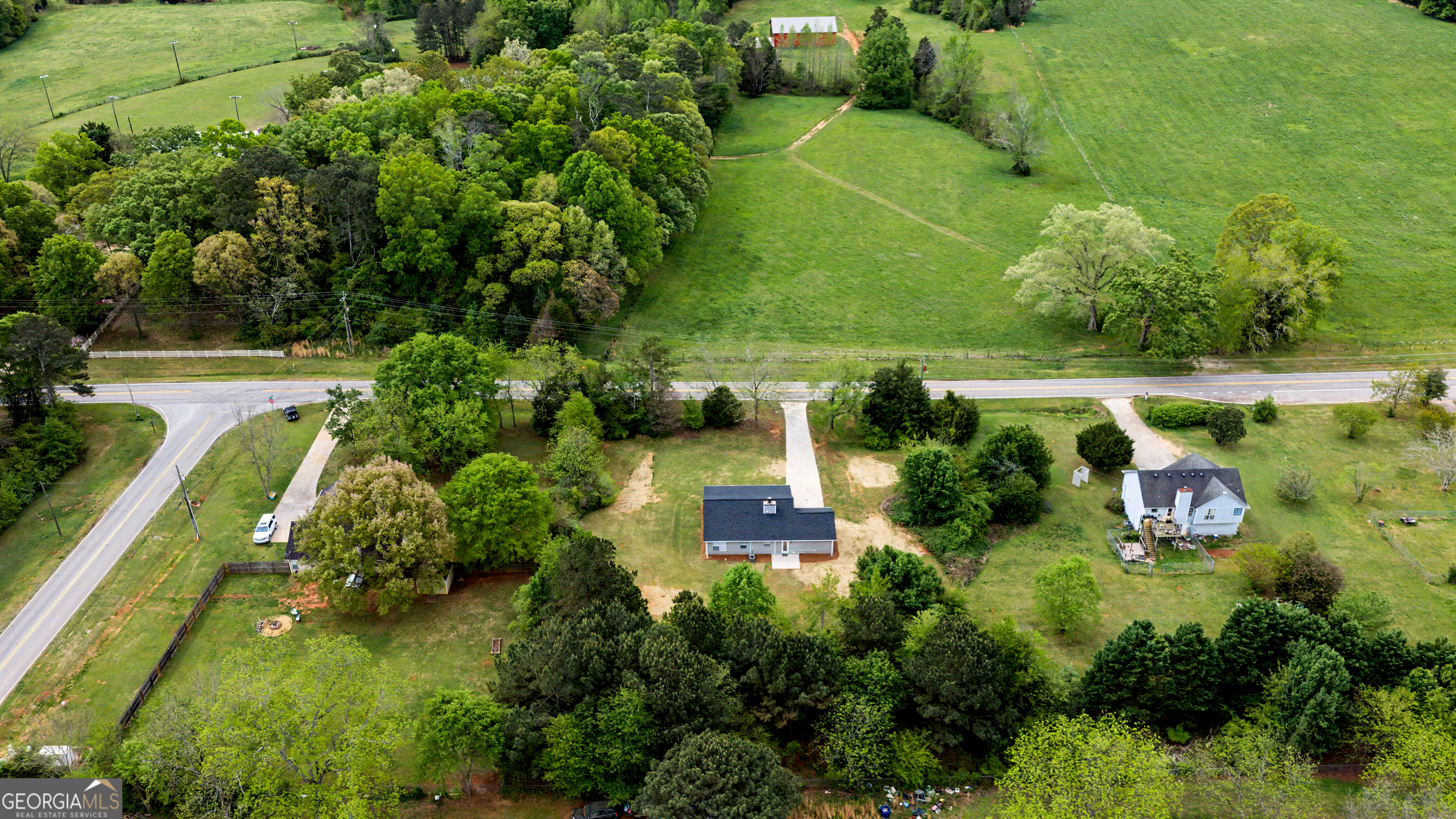 613 Coan Drive Locust Grove, GA 30248 - Photo 33 of 34 an aerial view of residential houses with outdoor space and street view