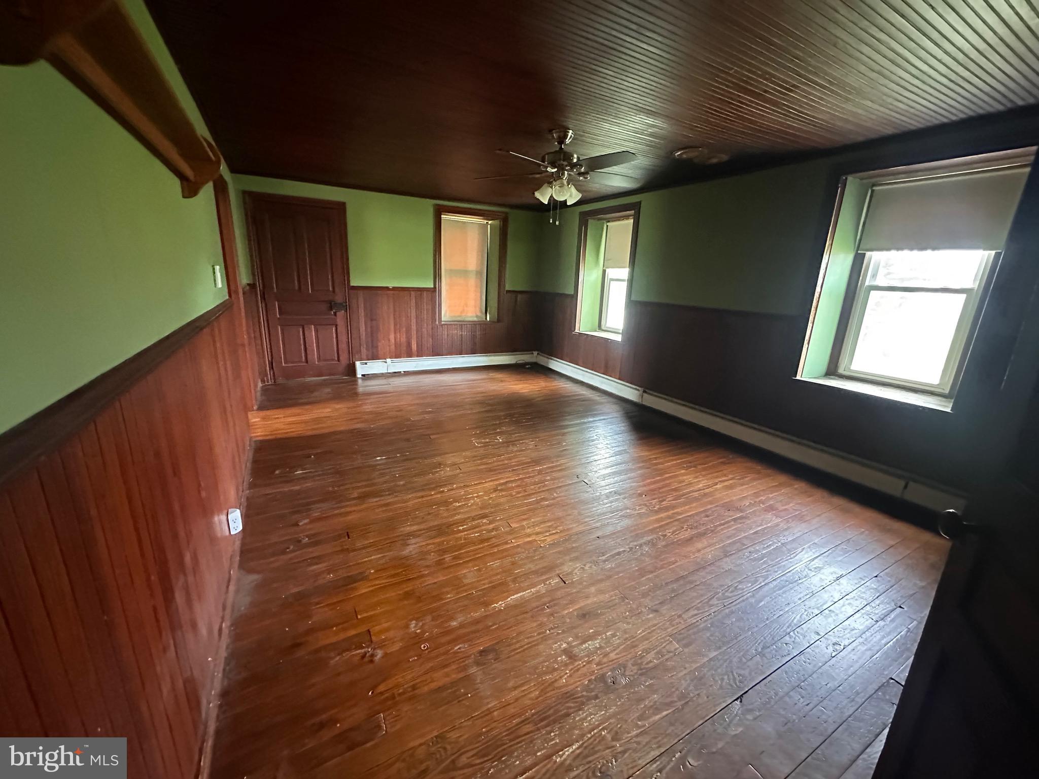 92 Deysher Road Fleetwood, PA 19522 - Photo 6 of 12 a view of empty room with wooden floor and fan