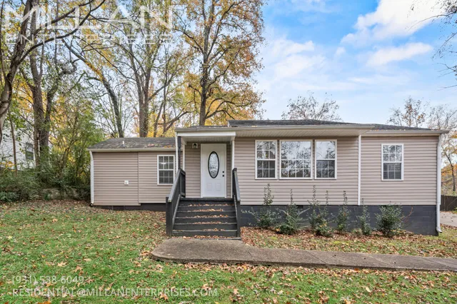 front view of a house with a yard