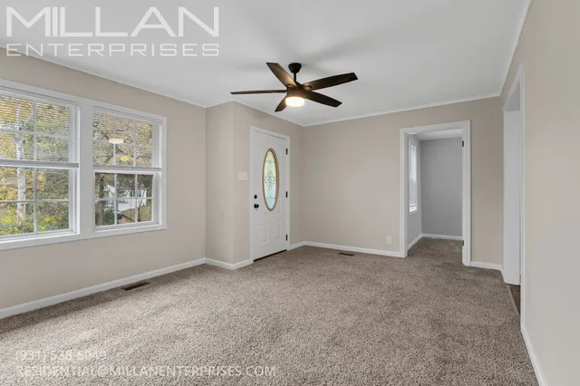 a view of an empty room with a window