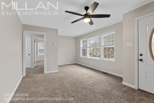 a view of an empty room with a window