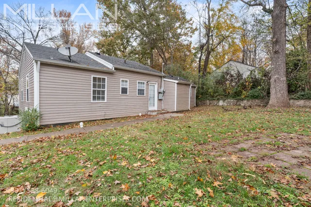 a house with trees in the background