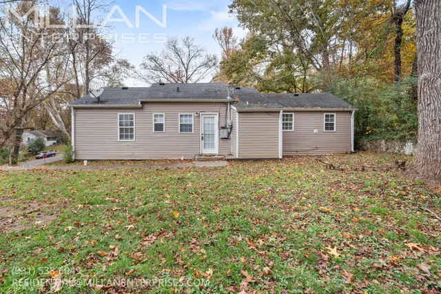 a house that has a tree in front of it