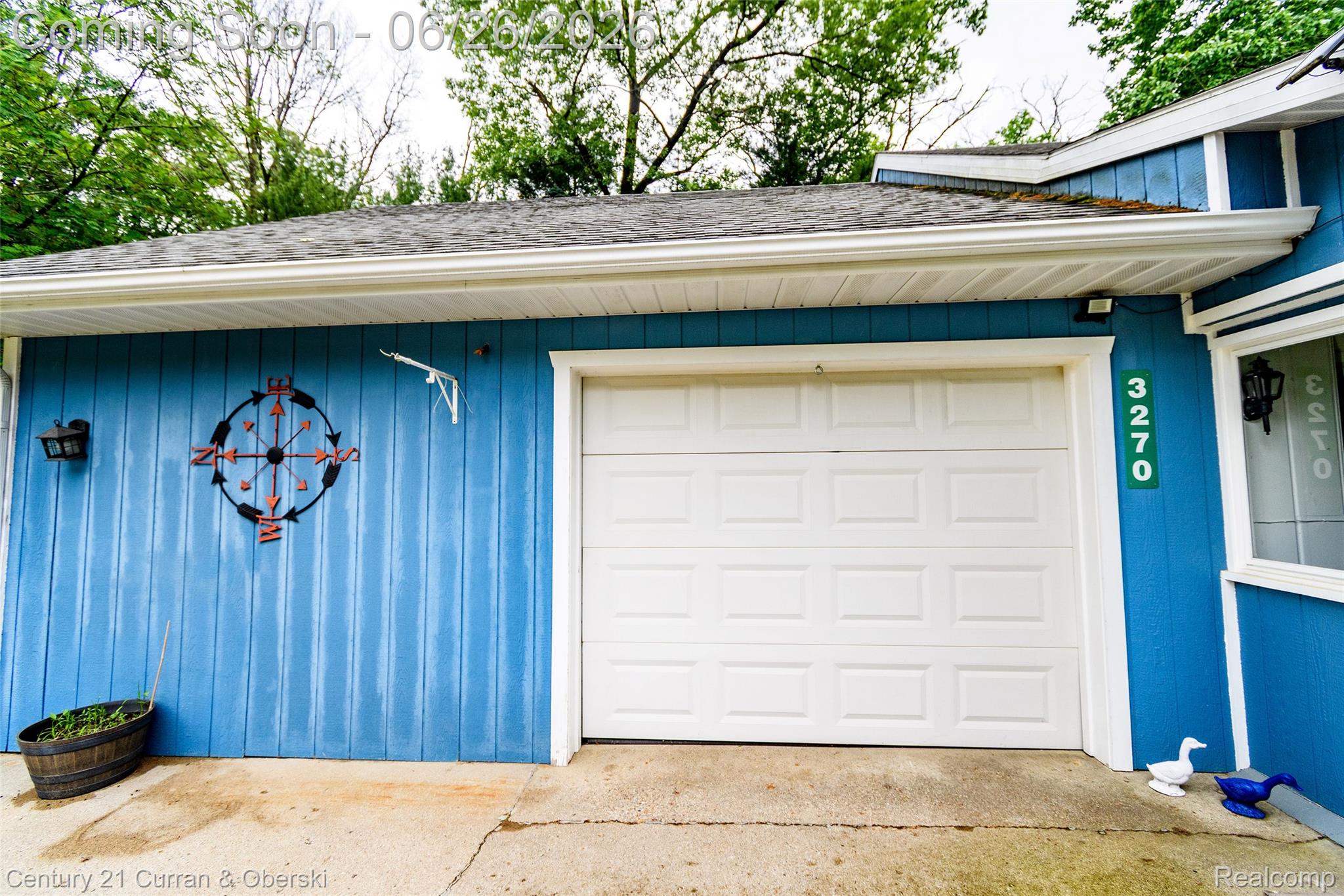 3270 Woods Road Harrison, MI 48625 - Photo 34 of 42 Attached single-panel garage door featuring a paneled design