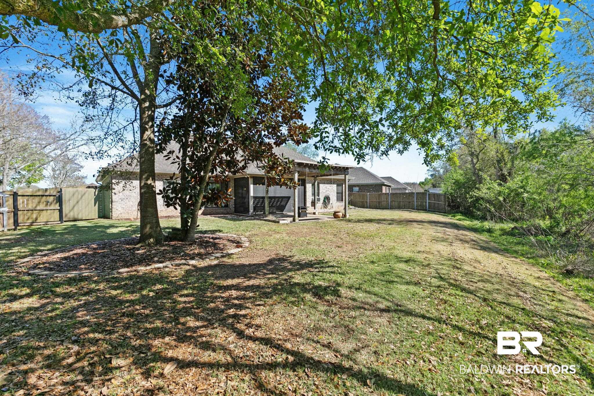 9584 Sanibel Loop Daphne, AL 36526 - Photo 40 of 48 Fenced backyard featuring a patio area