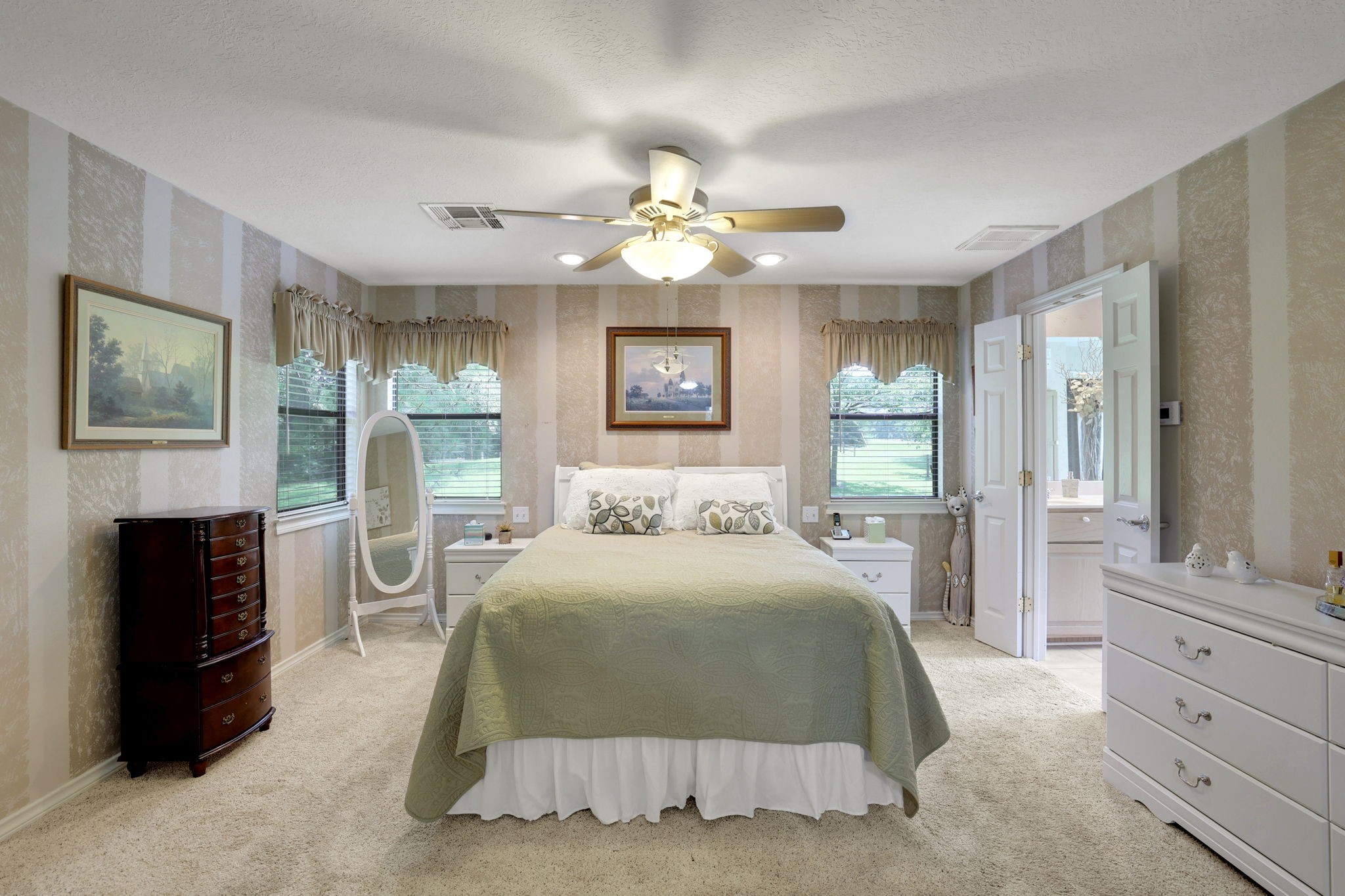 780 Hickory Ridge Drive Coldspring, TX 77331 - Photo 20 of 40 The primary bedroom is a comfortable retreat at the end of the day