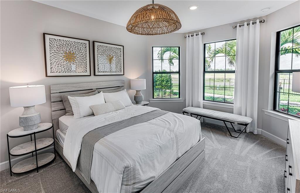 20322 Napa Loop Estero, FL 33928 - Photo 11 of 46 a bedroom with a bed and a couch