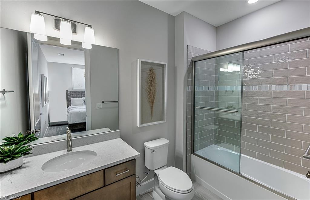 20322 Napa Loop Estero, FL 33928 - Photo 12 of 46 a bathroom with a sink toilet and shower